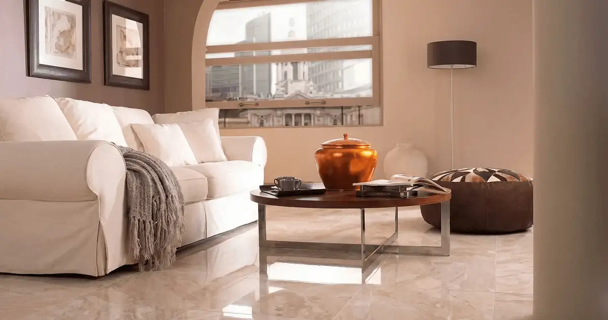 Modern living room with professionally installed marble flooring, a beige sofa, coffee table in St Paul, MN