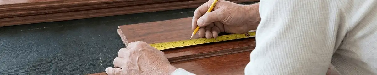 A professional installing wood flooring in St Paul, MN