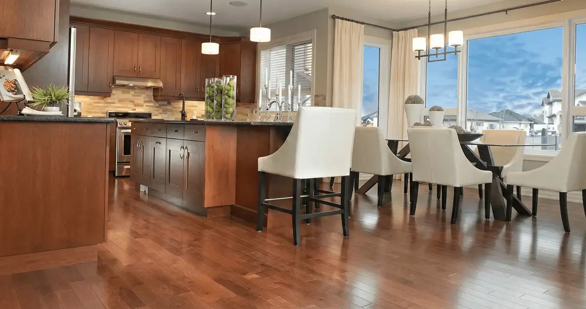 A modern kitchen with professionally installed wood flooring in St Paul, MN